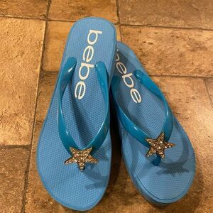 COPY - Bebe wedge flip flops blue